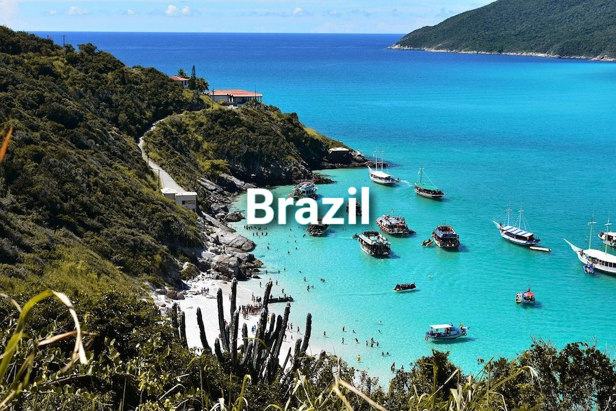 Beautiful tropical bay in Brazil with turquoise waters lush greenery and boats moored offshore